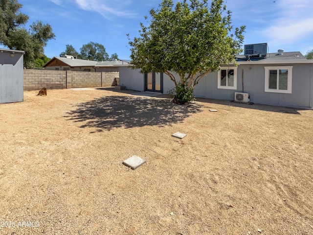 5308 N 77th Dr, Glendale, AZ 85303 - exterior space featuring a fenced backyard, ac unit, and french doors