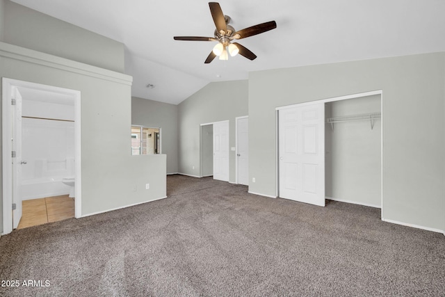 11154 W Ashley Chantil Dr, Surprise, AZ 85378 - unfurnished bedroom with carpet floors, vaulted ceiling, a closet, ensuite bath, and baseboards