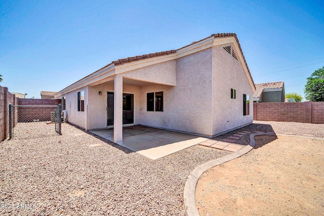 11154 W Ashley Chantil Dr, Surprise, AZ 85378 - rear view of property with stucco siding, a fenced backyard, a patio, and central AC