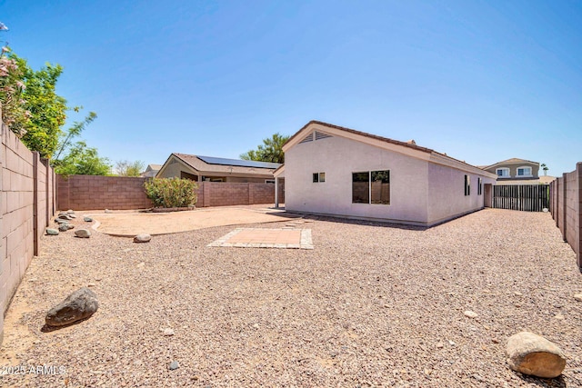 11154 W Ashley Chantil Dr, Surprise, AZ 85378 - rear view of property featuring a fenced backyard, a patio area, and stucco siding