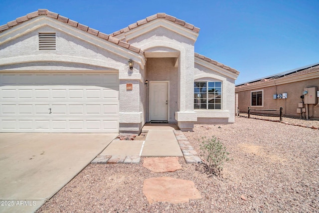 11154 W Ashley Chantil Dr, Surprise, AZ 85378 - view of front of property with driveway, an attached garage, a tiled roof, stucco siding, and fence