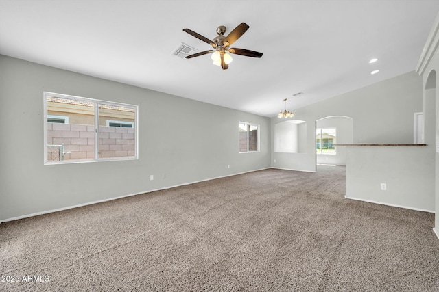 11154 W Ashley Chantil Dr, Surprise, AZ 85378 - unfurnished room with ceiling fan, vaulted ceiling, carpet, arched walkways, and a chandelier