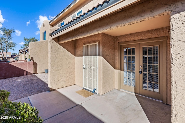 doorway to property featuring a patio area and french doors