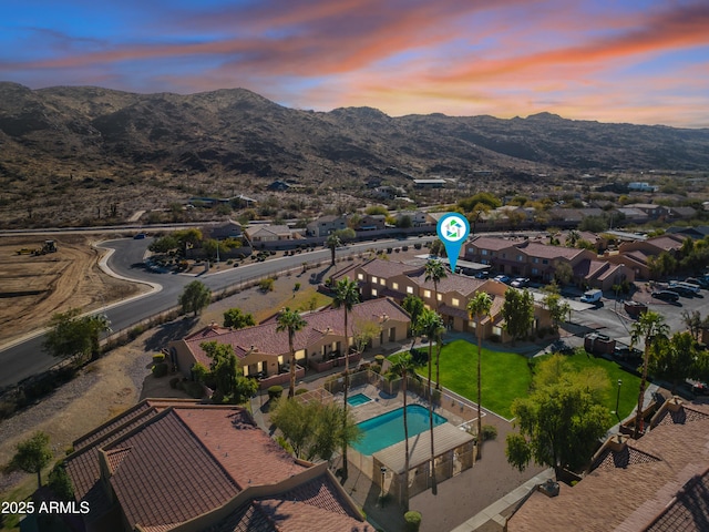 aerial view at dusk with a mountain view