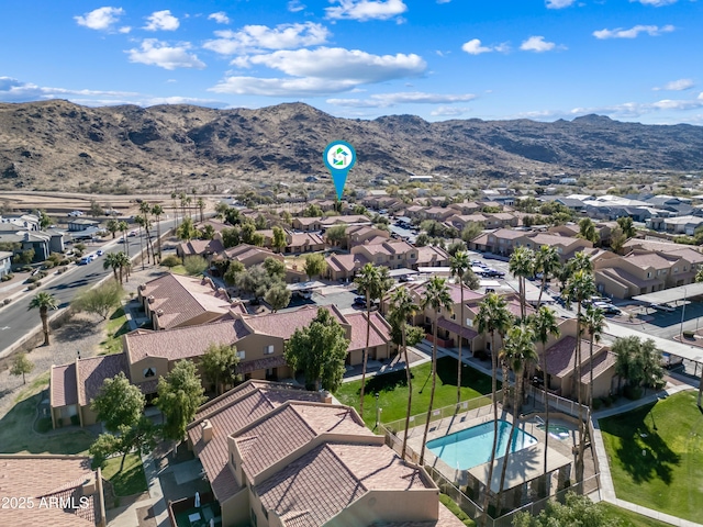 birds eye view of property featuring a mountain view