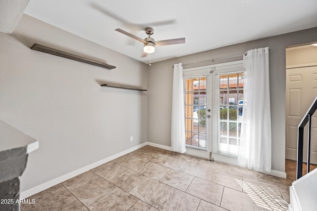 spare room featuring light tile patterned floors and ceiling fan