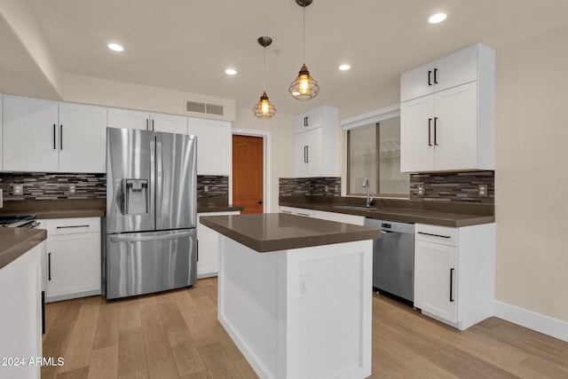 kitchen featuring white cabinets and appliances with stainless steel finishes