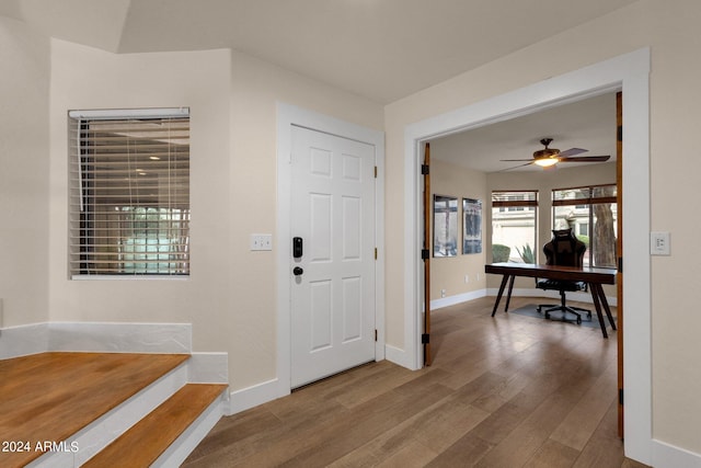 entrance foyer featuring ceiling fan and hardwood / wood-style flooring