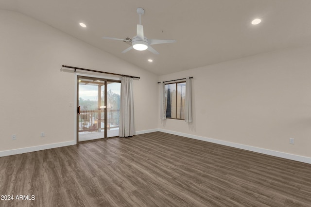 empty room featuring ceiling fan, hardwood / wood-style flooring, and lofted ceiling