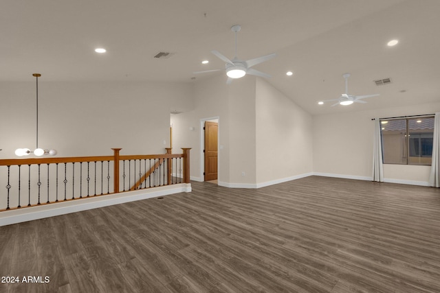 unfurnished room with high vaulted ceiling, ceiling fan, and dark wood-type flooring