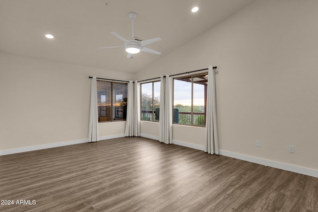 spare room featuring high vaulted ceiling, ceiling fan, and hardwood / wood-style floors