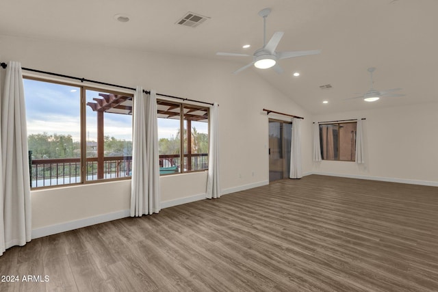 spare room featuring lofted ceiling, ceiling fan, and hardwood / wood-style floors