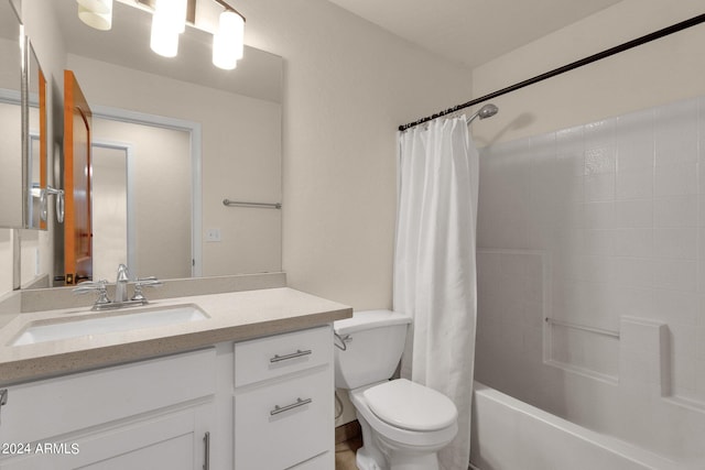 full bathroom featuring shower / tub combo with curtain, vanity, and toilet