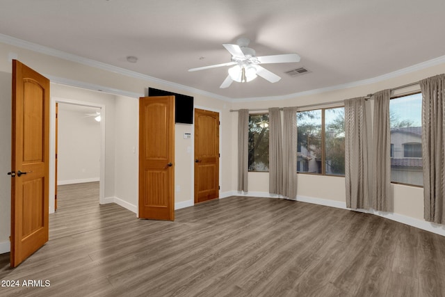 spare room featuring ceiling fan, crown molding, and hardwood / wood-style floors