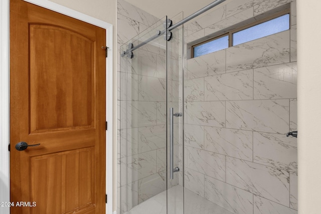 bathroom featuring an enclosed shower