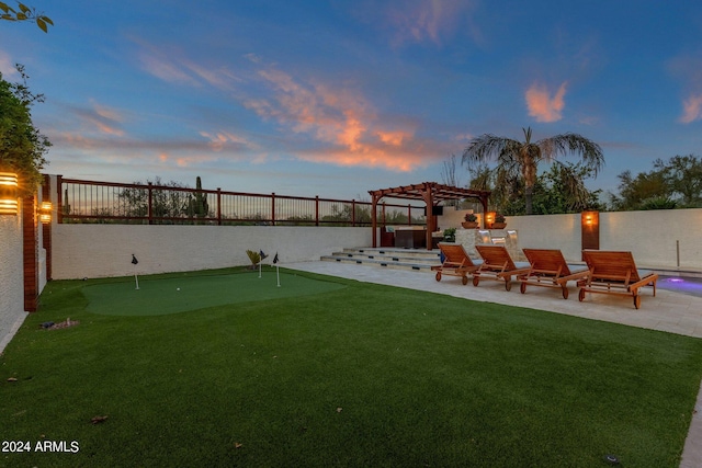 yard at dusk with a pergola and a patio area