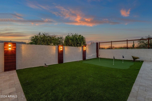 yard at dusk with a water view