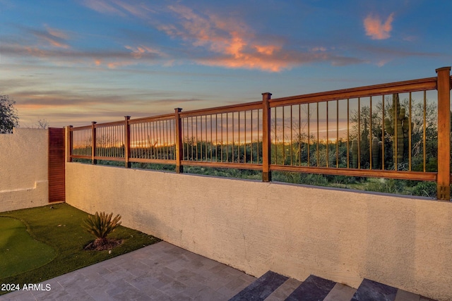 view of patio terrace at dusk