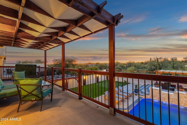 view of balcony at dusk