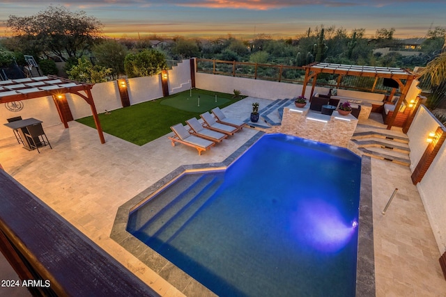 pool at dusk with a patio