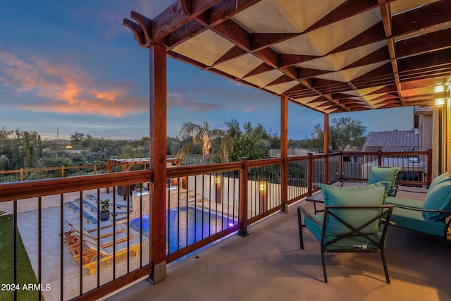 view of balcony at dusk