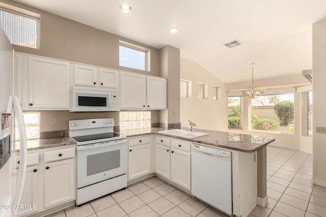 kitchen featuring white appliances, white cabinets, visible vents, and a sink