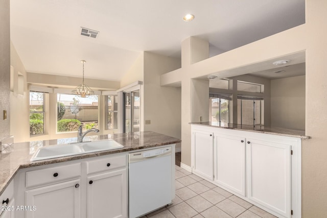 kitchen with a sink, visible vents, dishwasher, and white cabinetry