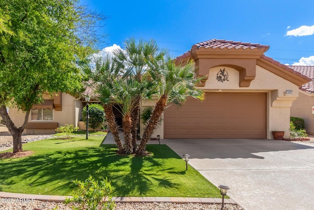 view of front facade with stucco siding, a front lawn, driveway, and a tiled roof