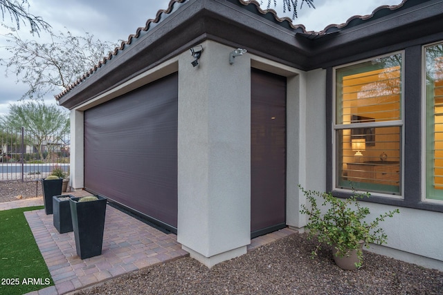 property entrance featuring a patio