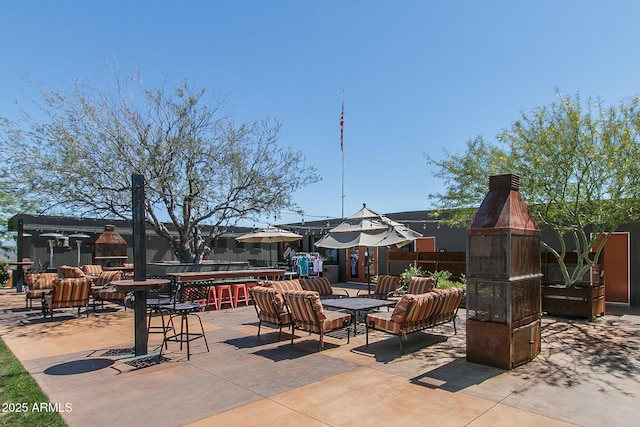 view of patio / terrace featuring an outdoor bar