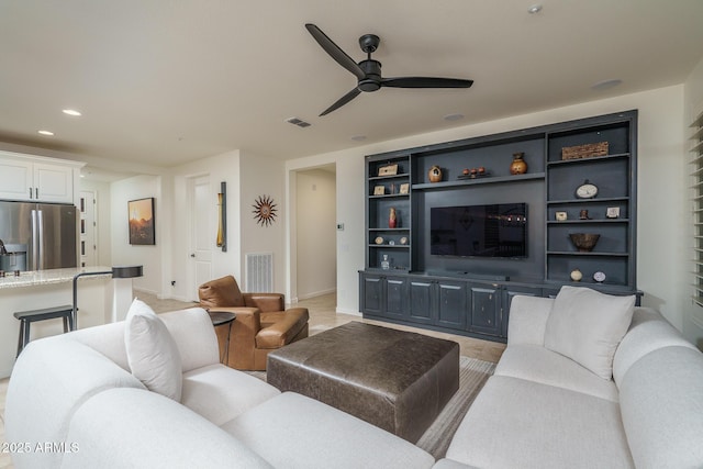 living room featuring ceiling fan