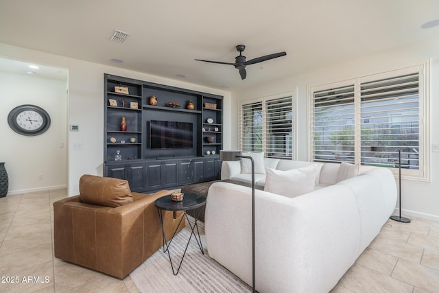 living room featuring light tile patterned flooring and ceiling fan