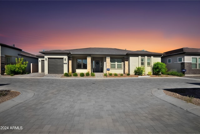 prairie-style home featuring a garage