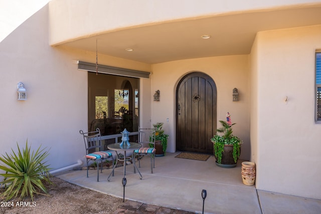 doorway to property featuring a patio