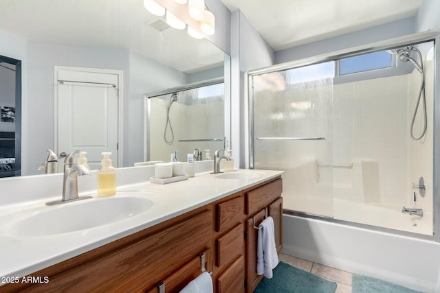 bathroom with vanity, bath / shower combo with glass door, and tile patterned floors