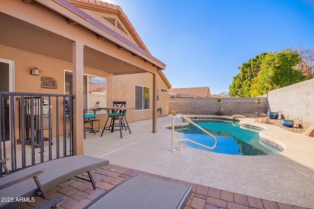 view of swimming pool featuring a patio area