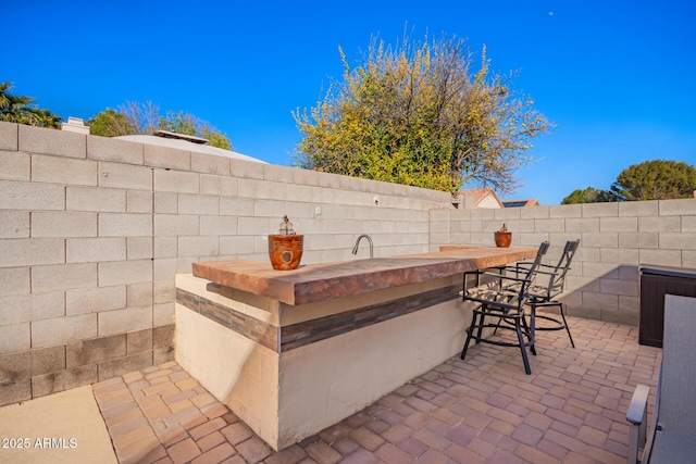 view of patio / terrace with exterior bar