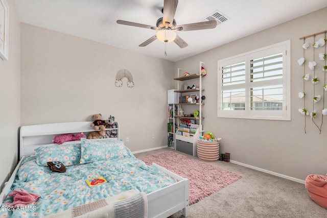 carpeted bedroom featuring visible vents, baseboards, and ceiling fan