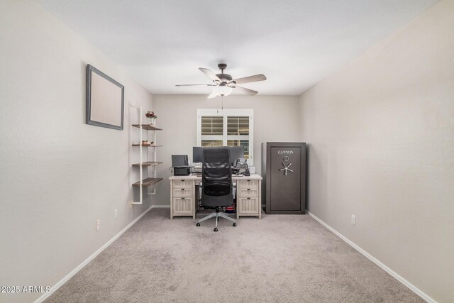office with ceiling fan, light carpet, and baseboards