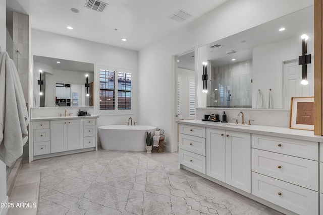 bathroom with shower with separate bathtub and vanity