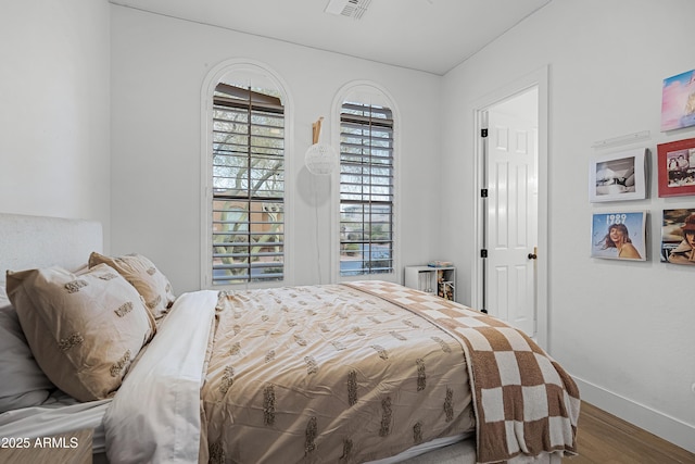 bedroom featuring hardwood / wood-style floors