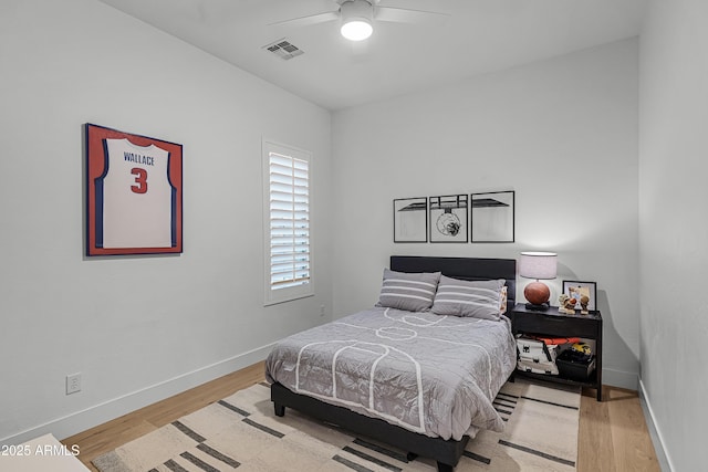 bedroom with ceiling fan and light wood-type flooring