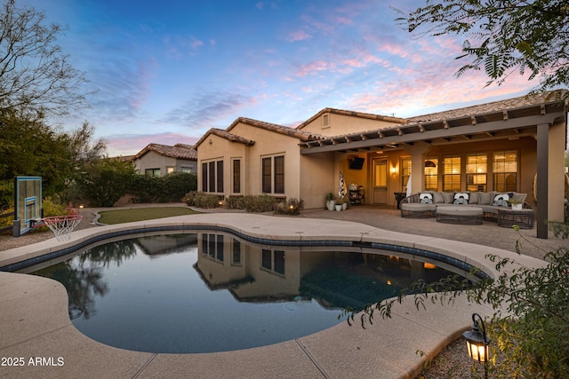 view of pool with outdoor lounge area and a patio