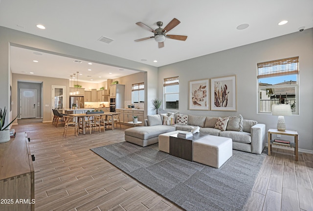 living room with ceiling fan