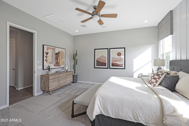bedroom featuring ceiling fan and carpet