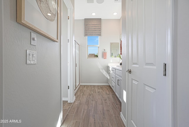 hall with light hardwood / wood-style floors