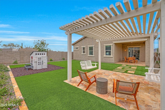 view of yard with a storage unit, a pergola, and a patio area