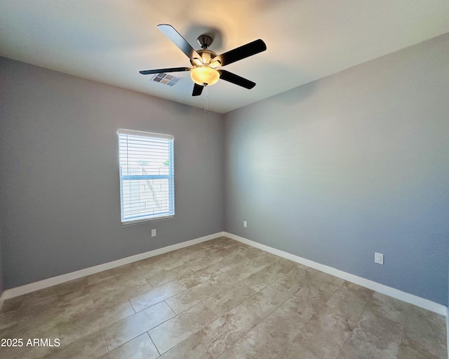 unfurnished room with baseboards, a ceiling fan, visible vents, and light tile patterned flooring