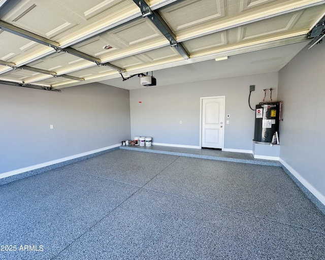 garage featuring baseboards, water heater, and a garage door opener