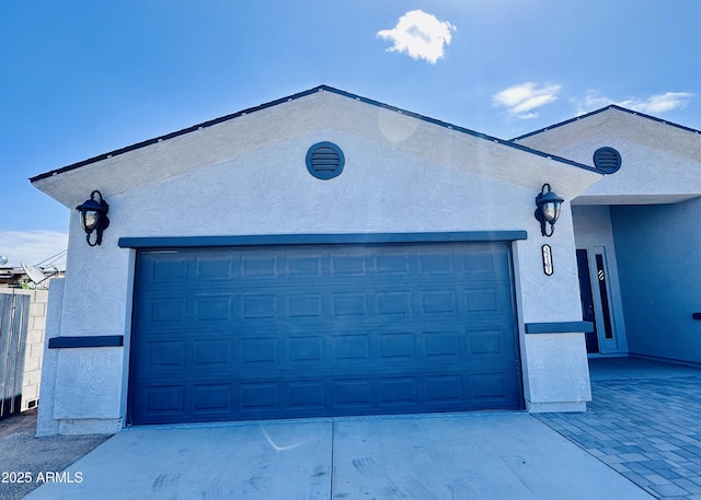 garage featuring driveway